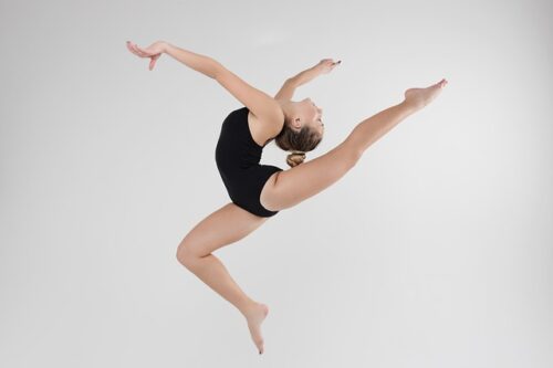A young girl doing amazing gymnastics.